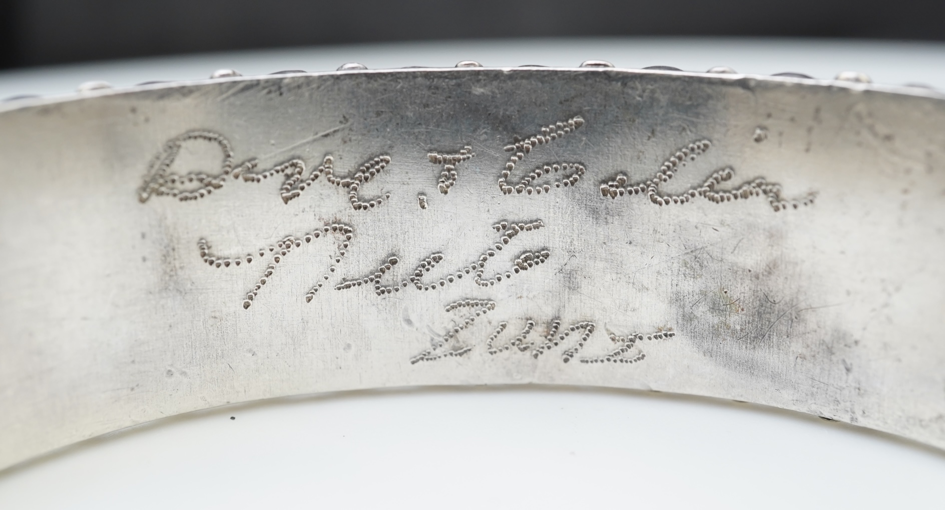 A collection of silver jewellery including a Zuni bangle